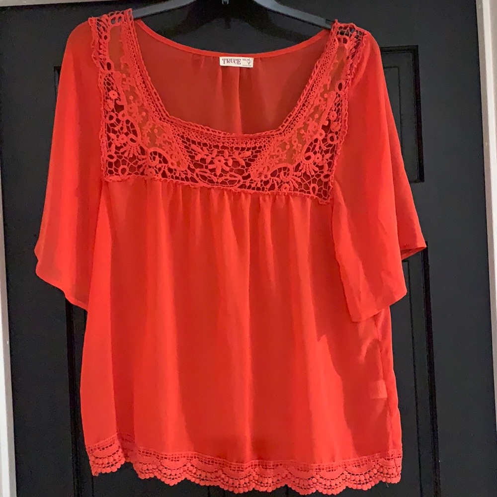 Women’s orange blouse in a large